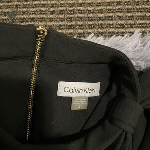 Calvin Klein Black Garment with Gold Accent